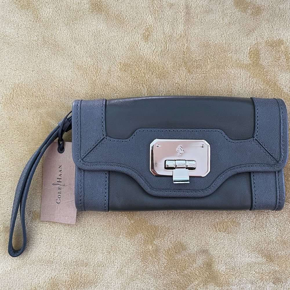 Cole Haan dark grey clutch with gold hardware and wristlet